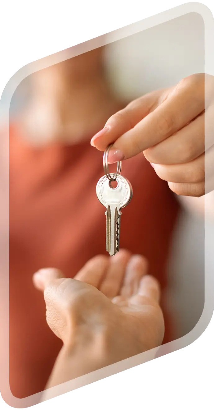 One hand passing keys to another hand